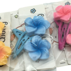 TIRA X20 UNIDADES FLORES SURTIDA EN COLOR TIPO TIC TAC HEBILLA