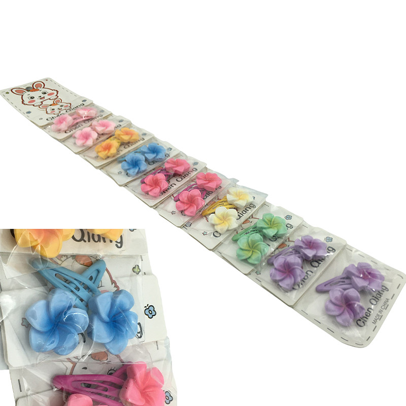 TIRA X20 UNIDADES FLORES SURTIDA EN COLOR TIPO TIC TAC HEBILLA